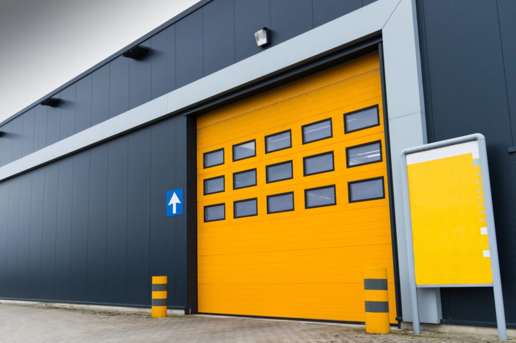 18847394 - yellow loading door in a storage building